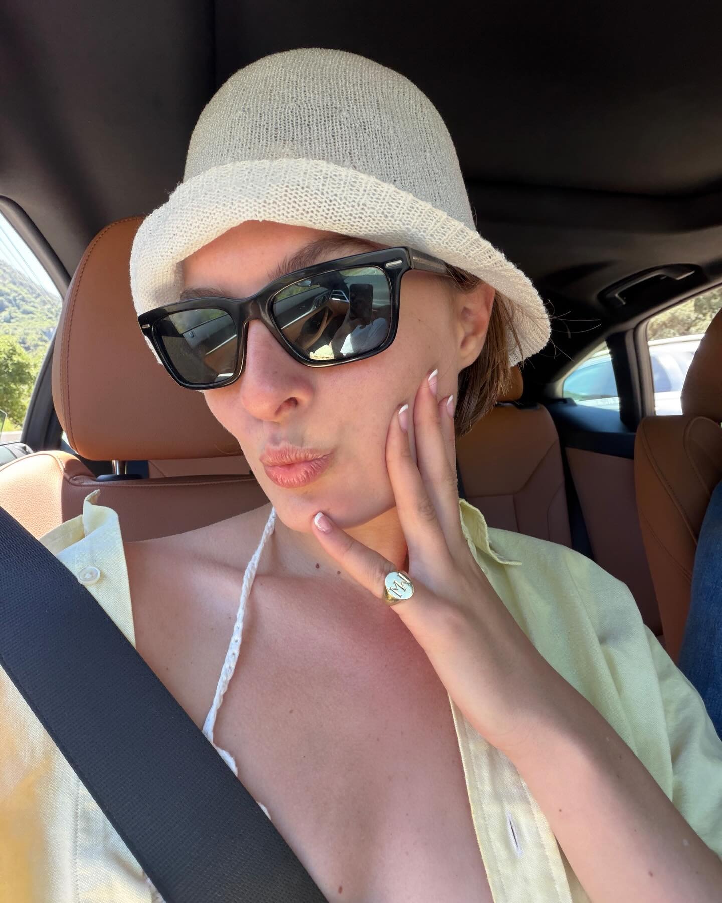 Influencer wearing a a crochet bucket hat.