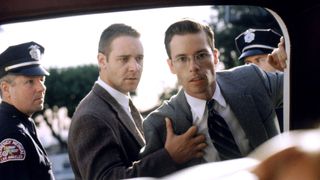 (L-R) Russell Crowe as Officer Wendell "Bud" White and Guy Pearce as Detective Lieutenant Edmund "Shotgun Ed" Exley in L.A. Confidential