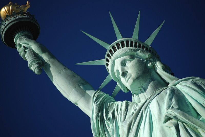 The Statue of Liberty stands on Liberty Island in New York Harbor