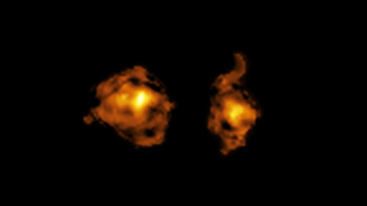 Two yellowish galaxies next to each other.