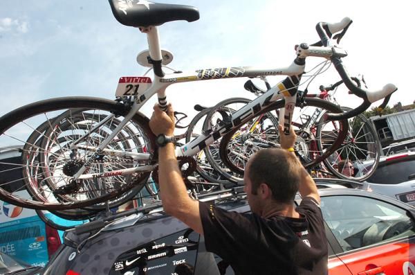 Lance Armstrong's bike goes back onto the car.