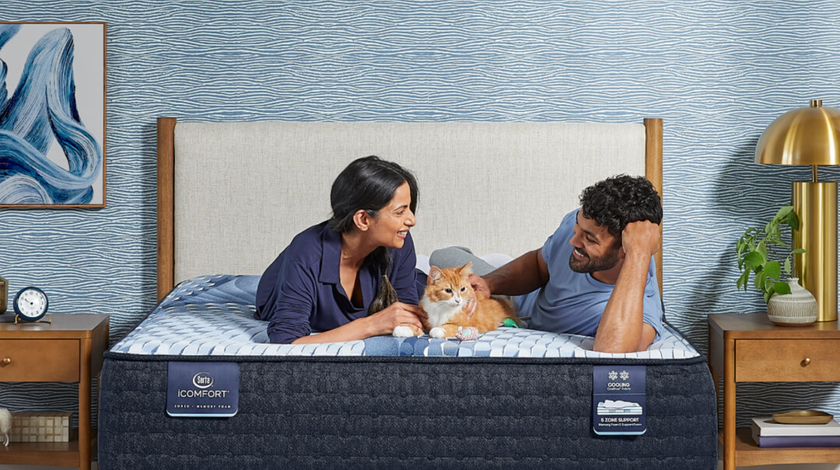 Couple sitting on mattress