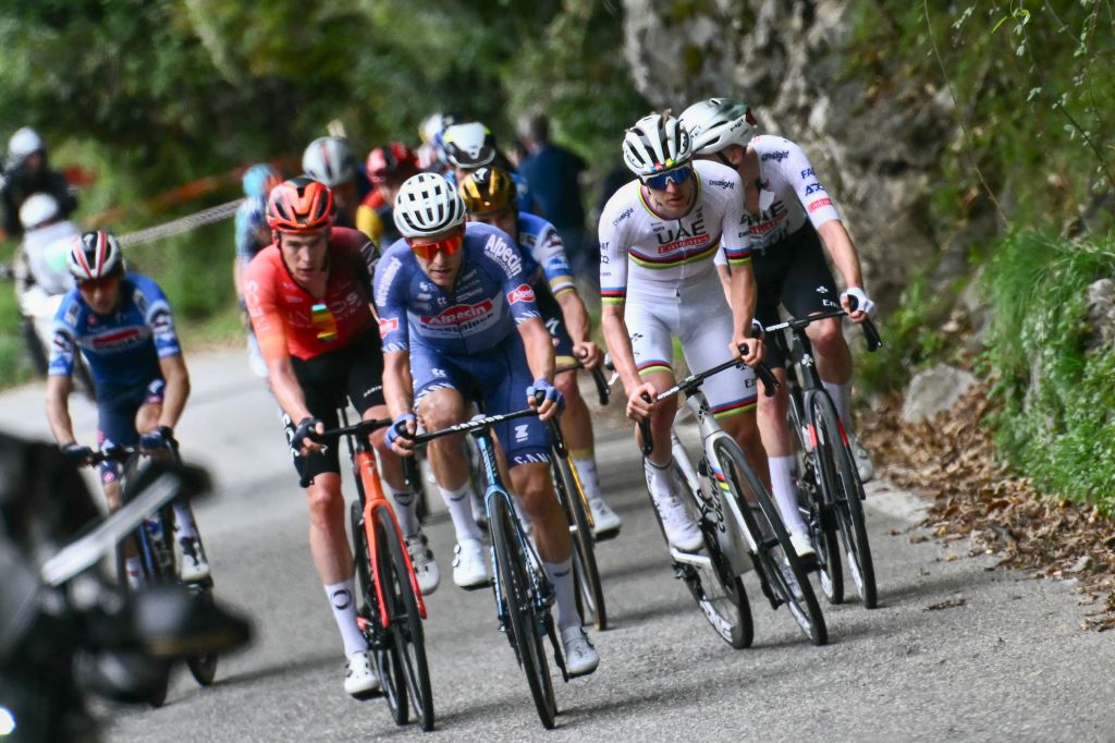 UAE Team Emirates team's Slovenian rider Tadej Pogacar (2nd R) accelerates to take the lead in the Colma Di Sormano ascent during the 118th edition of the Giro di Lombardia (Tour of Lombardy), a 252km cycling race from Bergamo to Como on October 12, 2024. (Photo by Marco BERTORELLO / AFP)