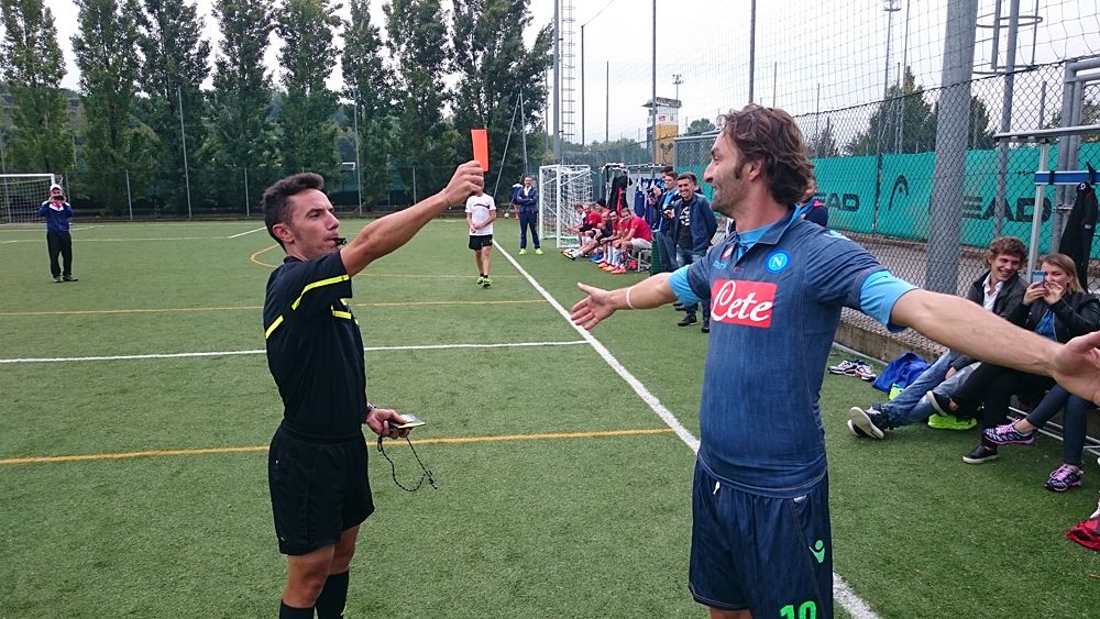 Joaquim Rodriguez cards a player - Katusha host their annual team-staff soccer match in Peschiera del Garda, Italy