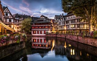 Strasbourg, one of the best foodie cities in France. The riverfront buildings at dusk