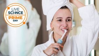 A Live Science Prime Day logo and a woman brushing her teeth with an electric toothbrush