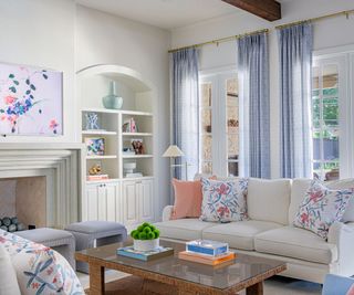 traditional living room with blue, white, and coral decor