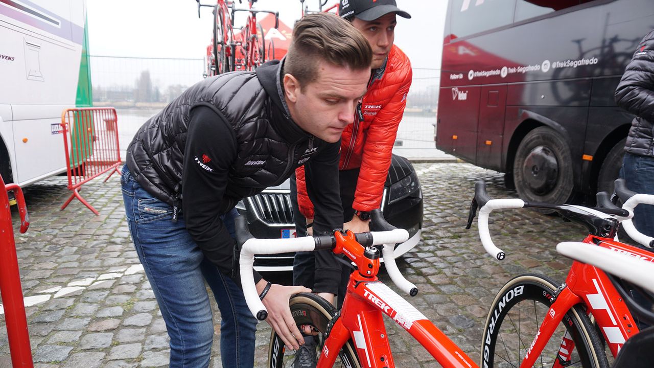 Trek-Segafredo mechanics double check tyre pressures before race sign on