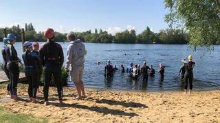Swimmers entering the Shepperton Open Water Swim lake