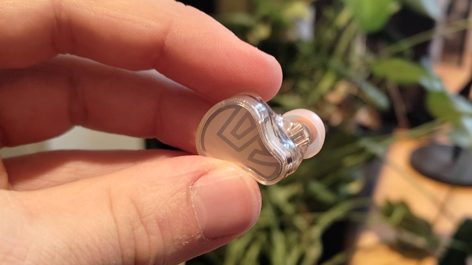 The Soundpeats H3 being held in a man&#039;s hand.