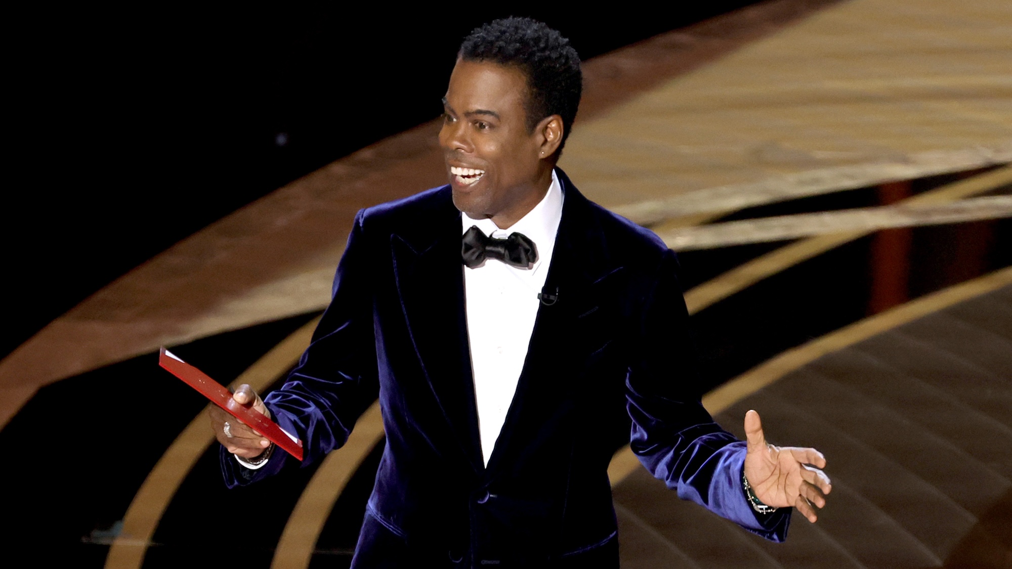 HOLLYWOOD, CALIFORNIA - MARCH 27: Chris Rock speaks onstage during the 94th Annual Academy Awards at Dolby Theatre on March 27, 2022 in Hollywood, California.