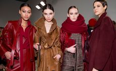 Models wear red leather, burgundy set and brown suede coat with matching handbags and oversized red scarf
