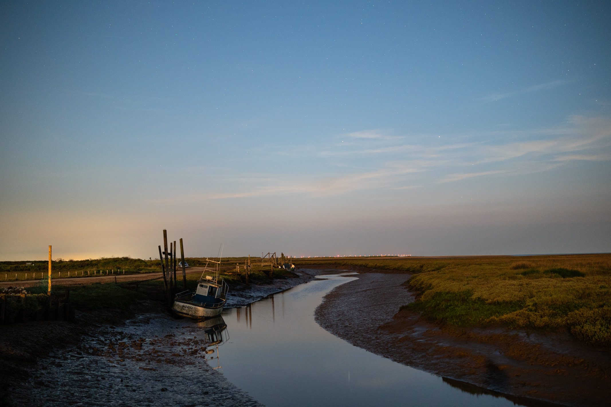 Photo of of a water channel taken with the Viltrox AF 27mm f/ 1.2 Pro under the June 2025 strawberry moon