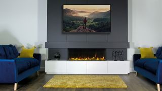 grey media wall with wall-mounted tv and electric fireplace