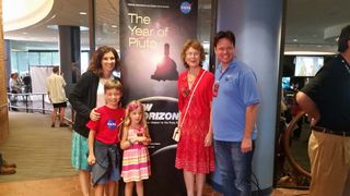 Pluto Pal Brandon Naylor, age 9 (front left), traveled with his family from Los Angeles to watch the Pluto flyby of NASA's New Horizons spacecraft at the mission operations center at Johns Hopkins University Applied Physics Laboratory on July 14, 2015. With him are sister Maya (front right), mother Michelle (back left), grandmother Doreen and father Bret.