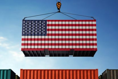 United States trade cargo container hanging against clouds background.