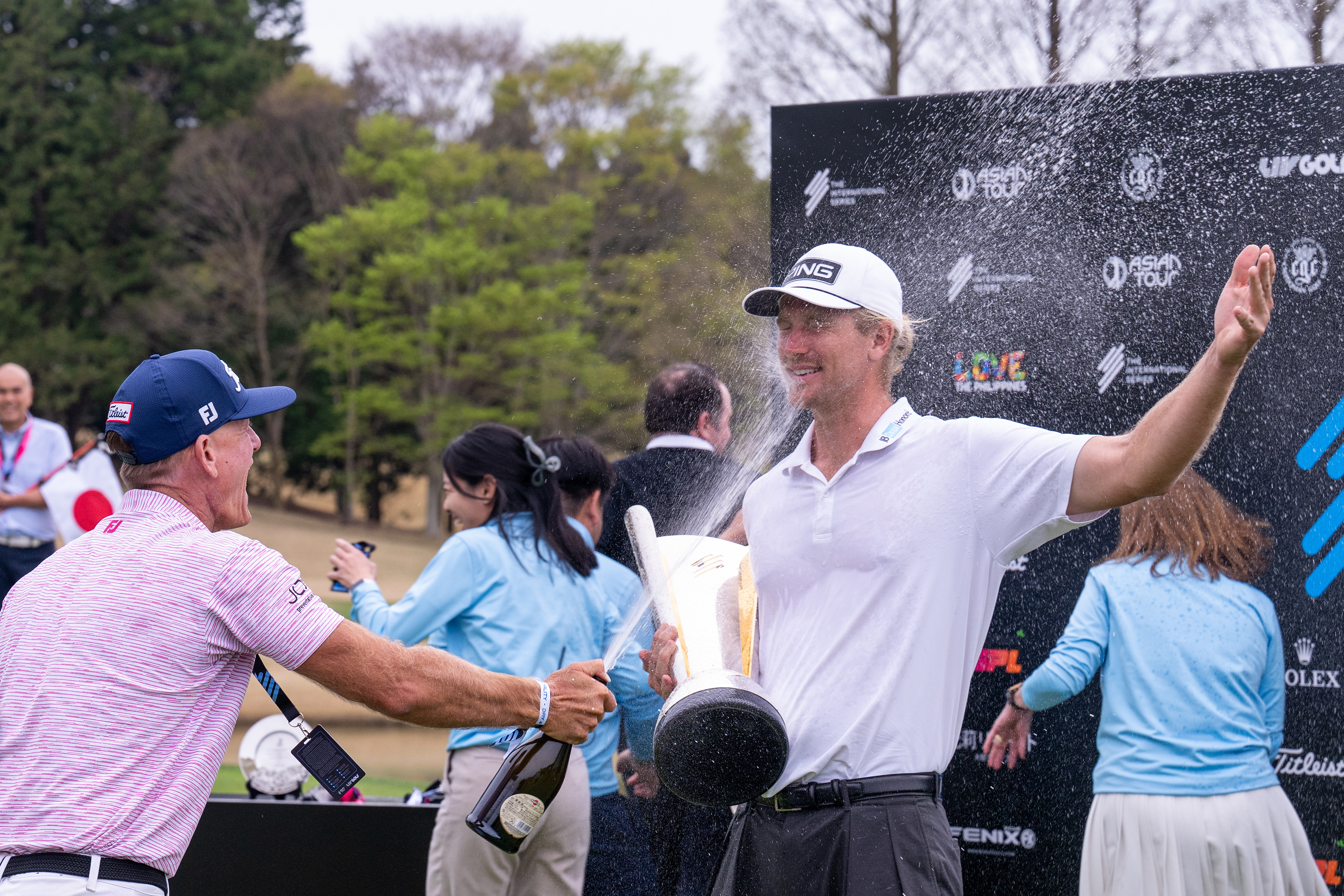 YOKOSHIBAHIKARI, JAPAN - APRIL 05: Travis Smyth of Australia is sprayed with Champagne after winning the International Series Japan at Caledonian Golf Club on April 05, 2026 in Yokoshibahikari, Chiba, Japan. (Photo by Jason Butler/Getty Images)