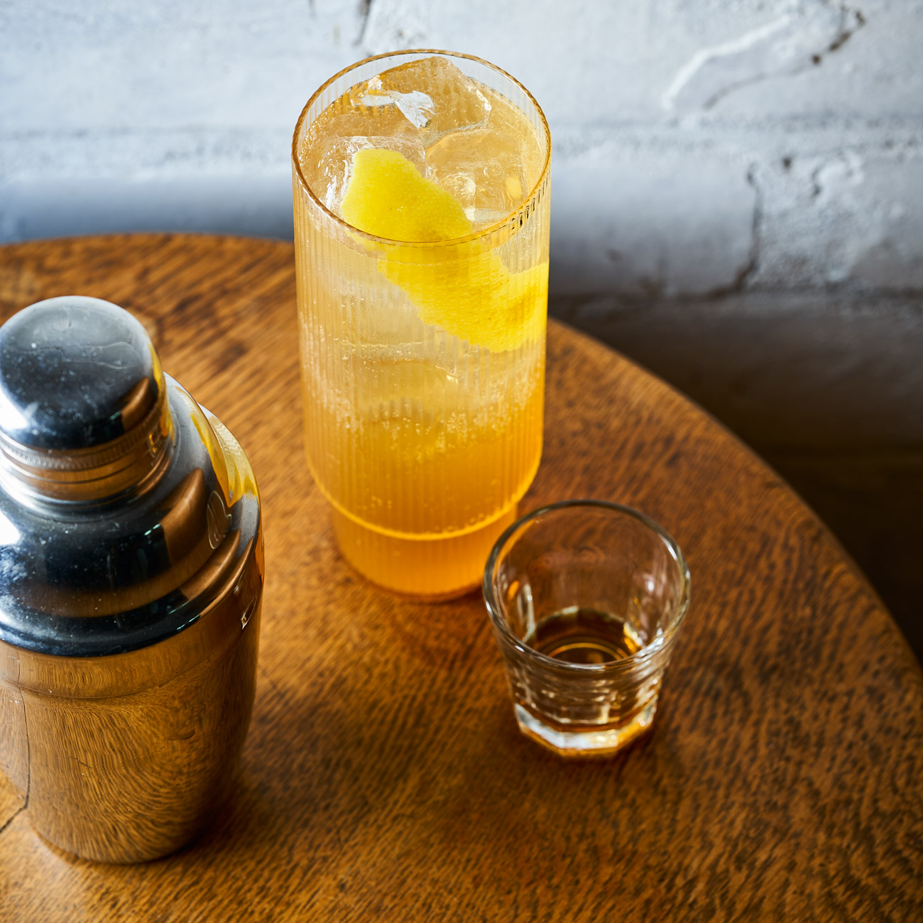 Cocktail glass and shaker on a table