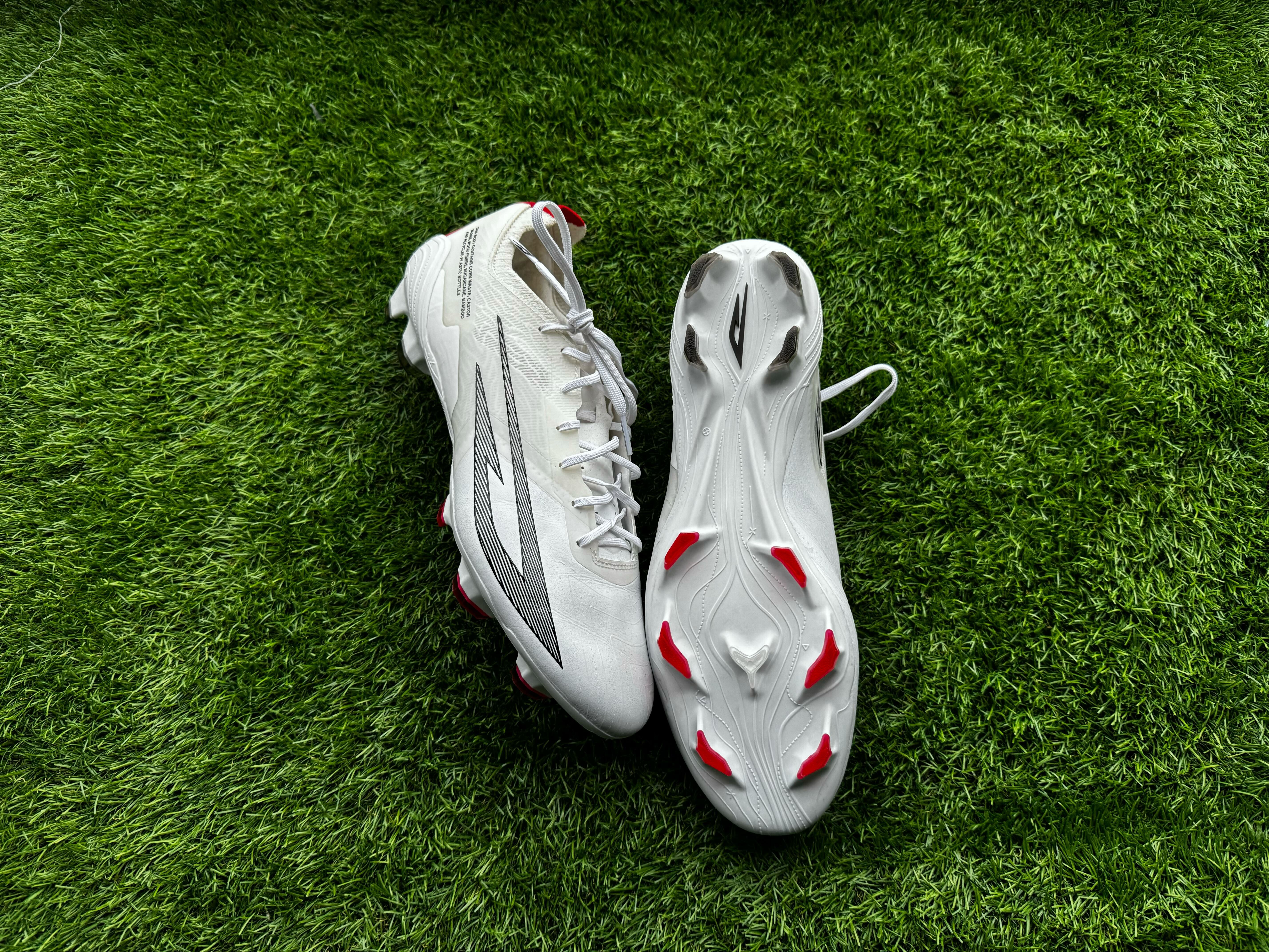 Sokito Scudetta football boots reviewed. The boots are placed on a piece of turf ahead of being reviewed.