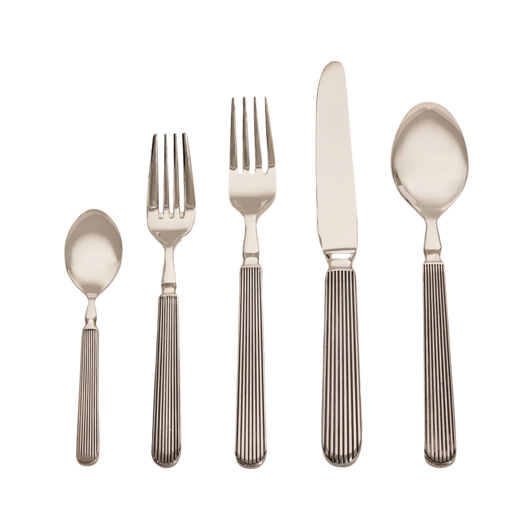 set of cutlery in silver with fluted detailing on the handles