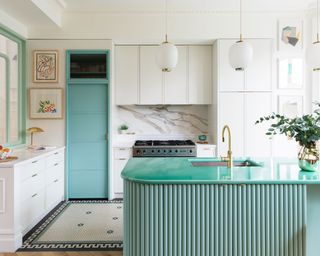 White kitchen with green pastel curved island