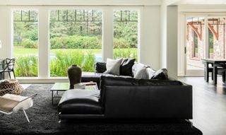 A black leather sofa in a living room