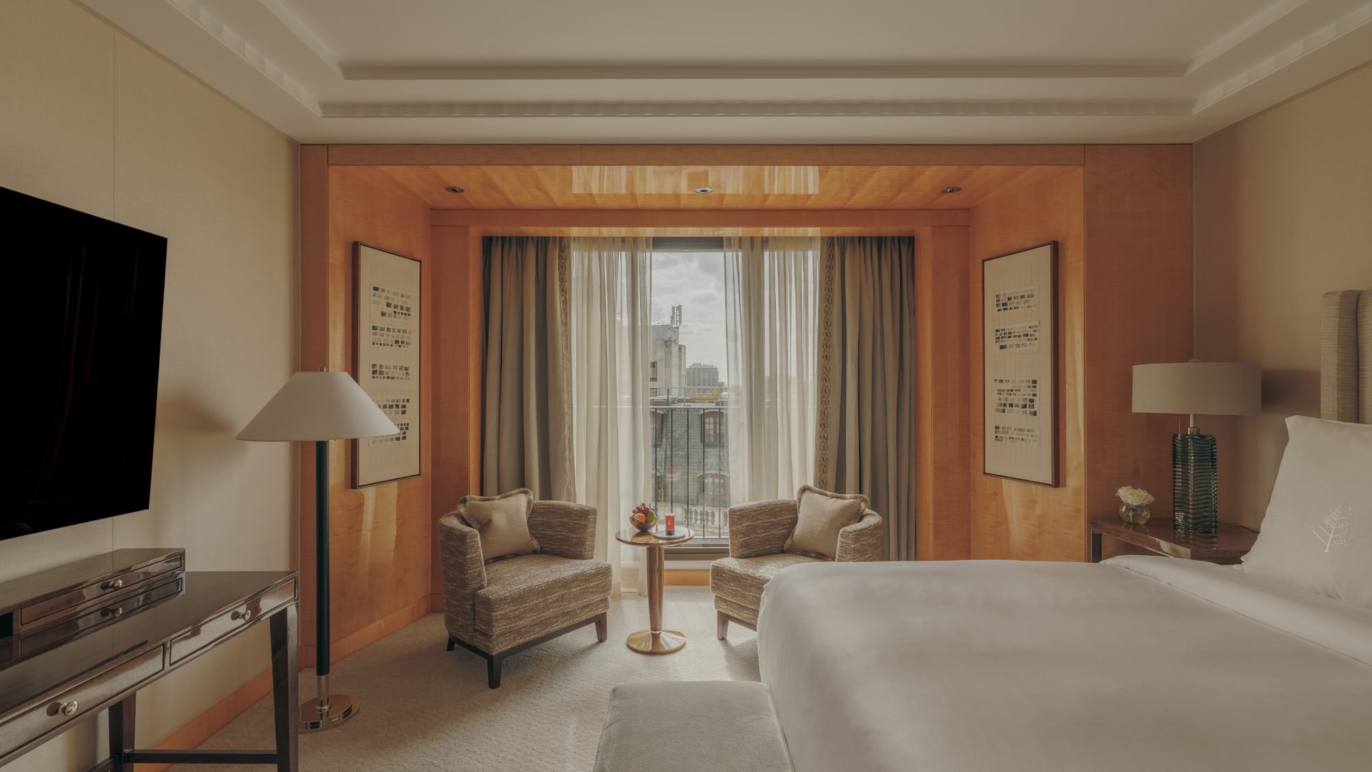 A wide shot of the deluxe suite bedroom