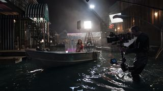 Rebecca Ferguson drives a boat on the set of Reminiscence