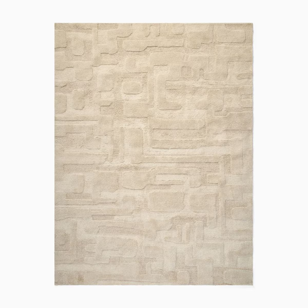 textured beige area rug