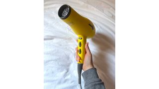Original image of handheld close-up of the Drybar Buttercup Dryer