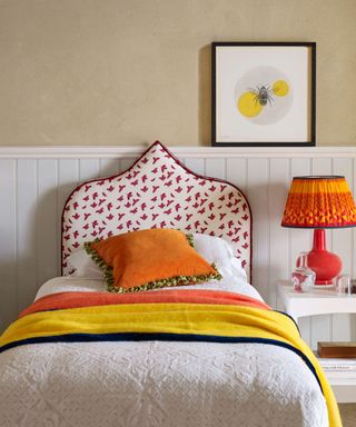 Kelling Designs pink and white patterned headboard with bright accessories and lighting