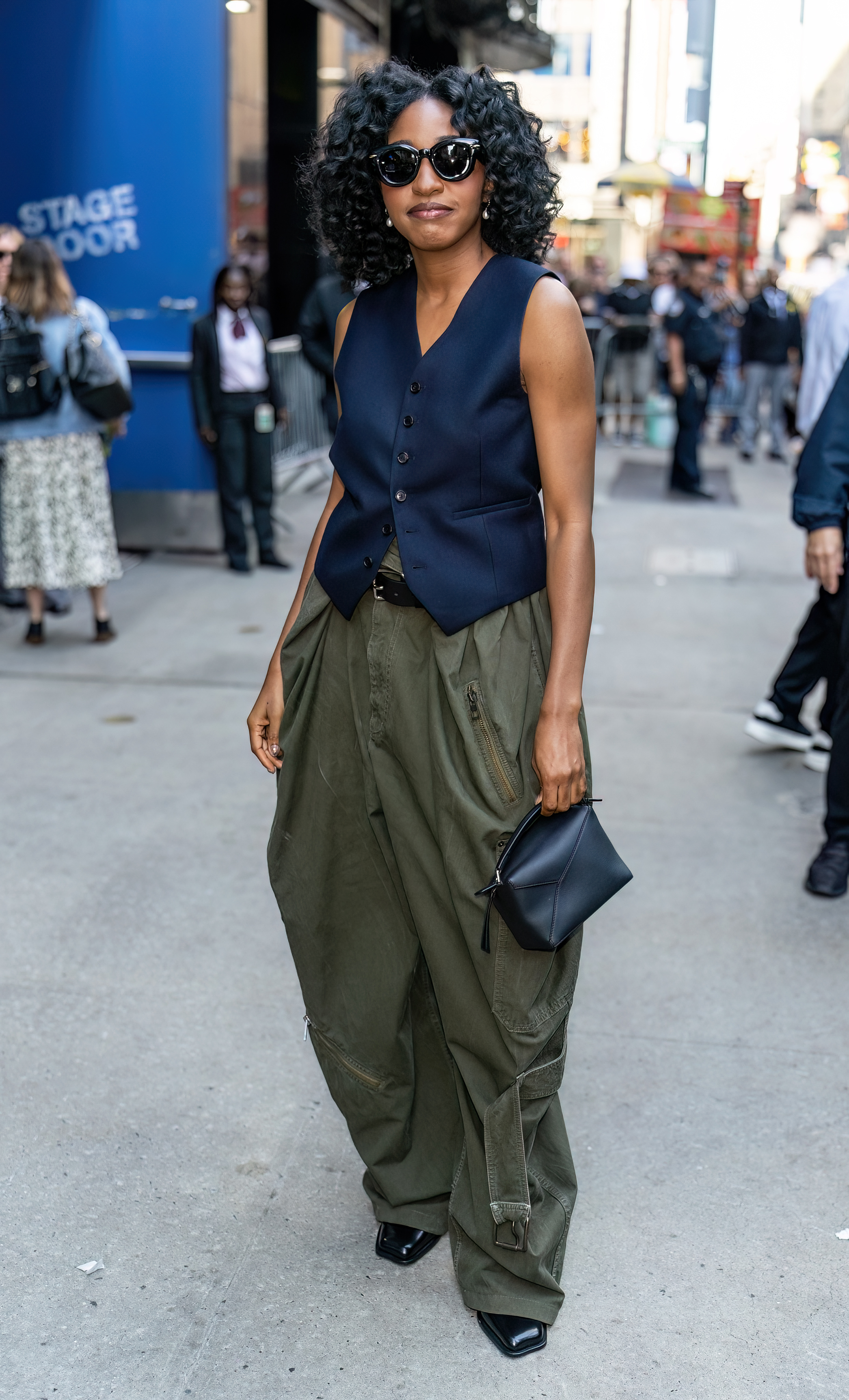 An image of Ayo Edebiri wearing a Loewe Puzzle bag while doing press in New York in 2024.