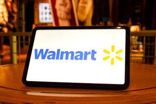 A tablet on a side tablet displaying the Walmart logo