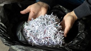shredded paper in a recycling bin