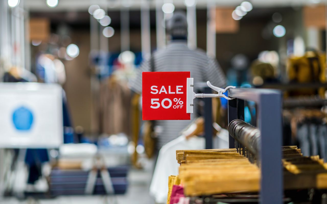 sale 50% off mock up advertise display frame setting over the clothes line in the shopping department store for shopping, business fashion and advertisement concept