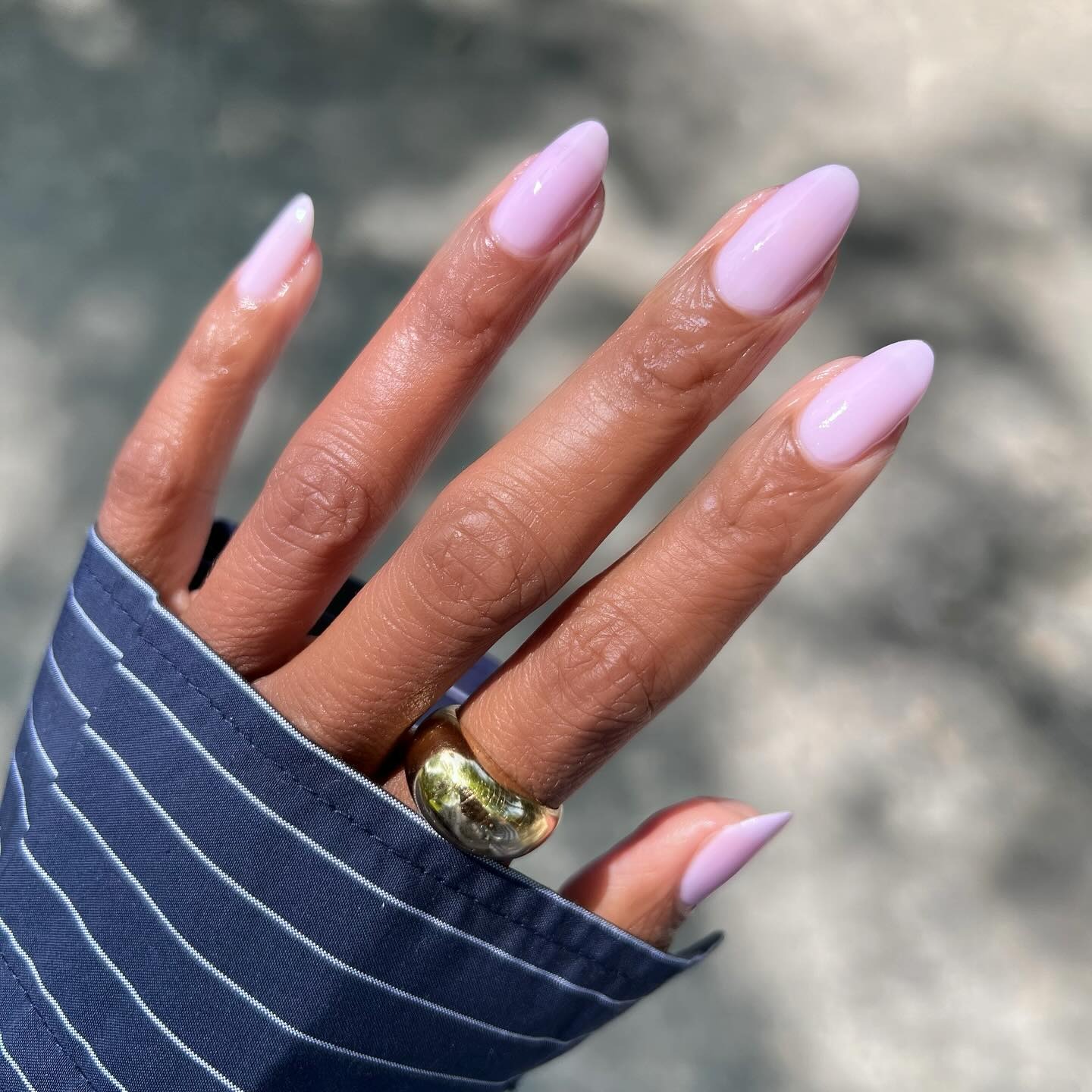 Person wearing lavender jelly nail polish.