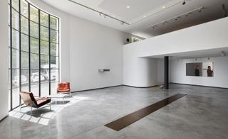 the retail element at France's Fondation CAB products displayed white shelves