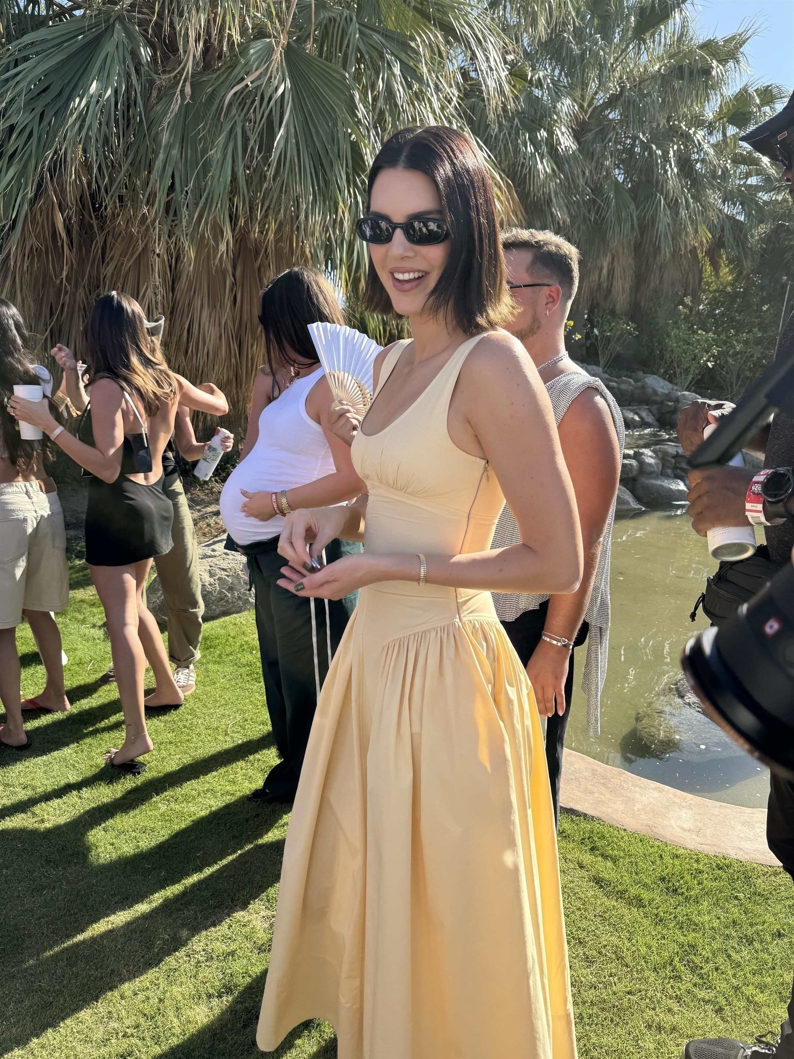 Kendall Jenner wears a butter yellow dress at RevolveFest