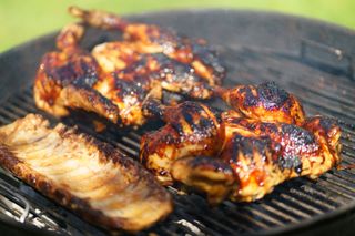 Chicken cooking on a BBQ