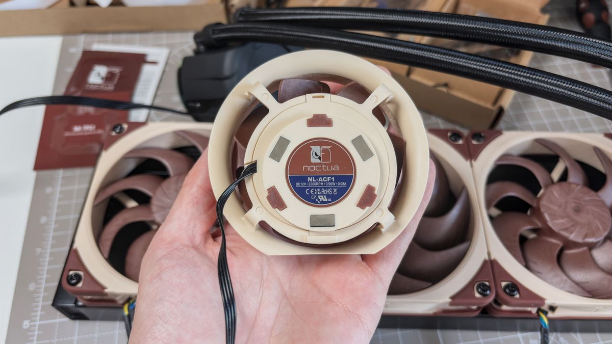 A Noctua NL-LC1 liquid cooler being installed on a test bench for testing.