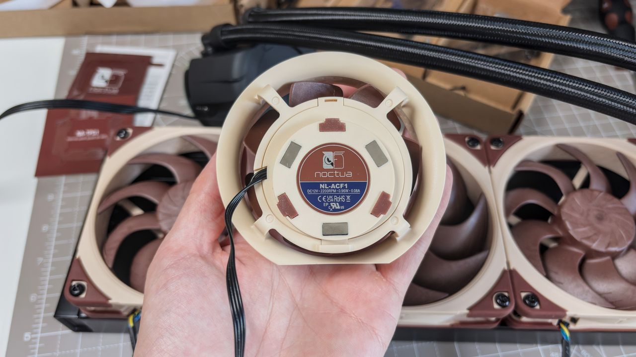 A Noctua NL-LC1 liquid cooler being installed on a test bench for testing.