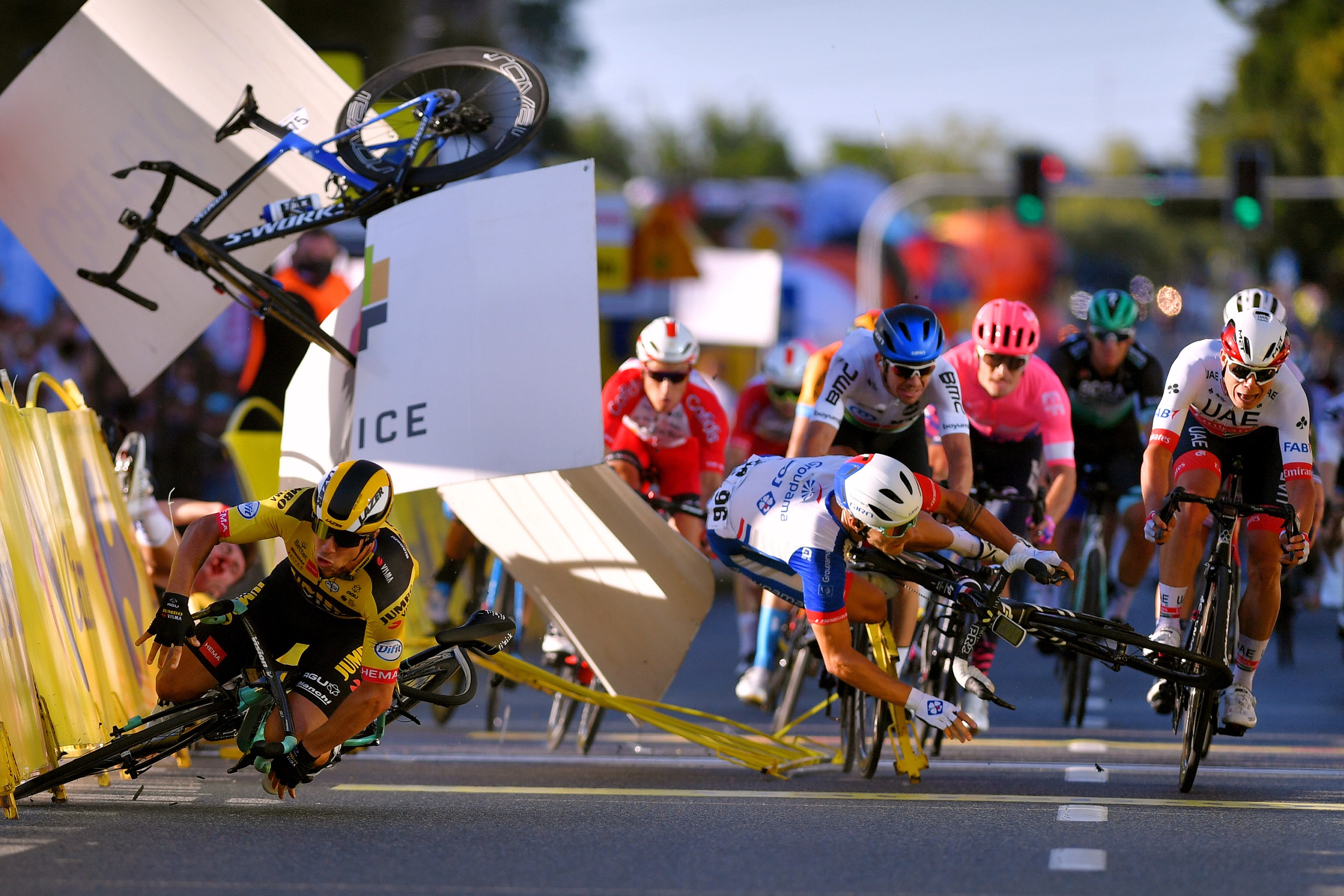Barriers and bikes flying as riders crash at the finish of the Tour de Pologne 2020 stage 1 crash