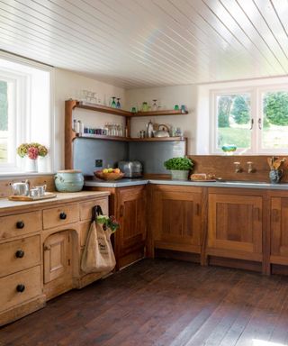 rustic kitchen with wooden floors and cabinets
