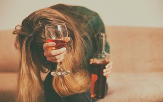 Woman drinking too much - a sign of depression