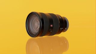 Sony FE-24-70mm lens on a yellow background
