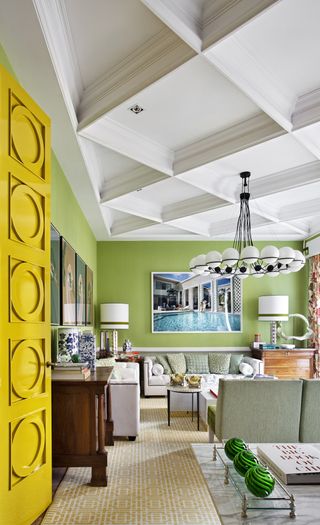 a green room with a coffered ceiling