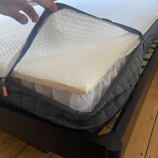 The Emma Hybrid Original mattress being tested by a female reviewer