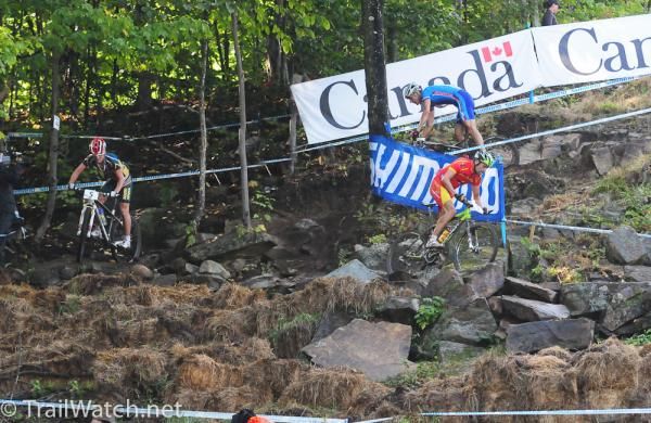 Jose Antonio Hermida Ramos (Spain) leads Burry Stander and Jaroslav Kulhavy (Czech) through what looks like a rock quarry