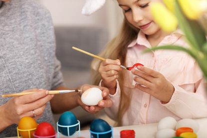 Mother and daughter doing Easter crafts for kids