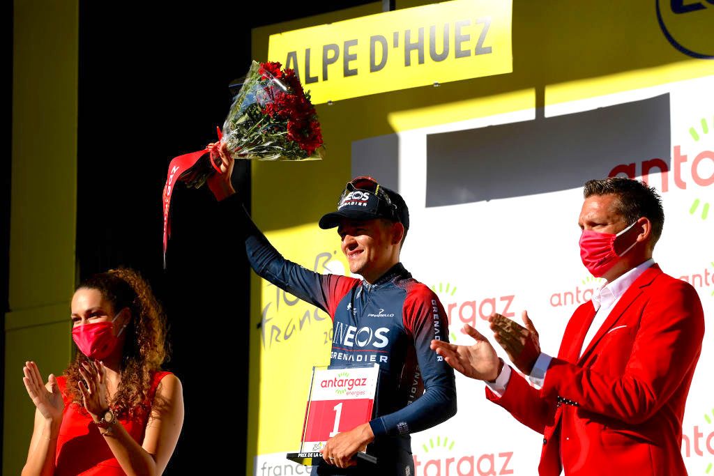ALPE D'HUEZ, FRANCE - JULY 14: Thomas Pidcock of United Kingdom and Team INEOS Grenadiers celebrates winning the trophy for the most combative rider on the podium ceremony after the 109th Tour de France 2022, Stage 12 a 165,1km stage from Brian&Atilde;&sect;on to L'Alpe d'Huez 1471m / #TDF2022 / #WorldTour / on July 14, 2022 in Alpe d'Huez, France. (Photo by Tim de Waele/Getty Images)